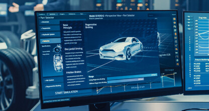 A computer monitor displays a 3D car model and various vehicle simulation data in a modern automotive engineering lab, providing valuable insights for intellectual property law and litigation support teams.