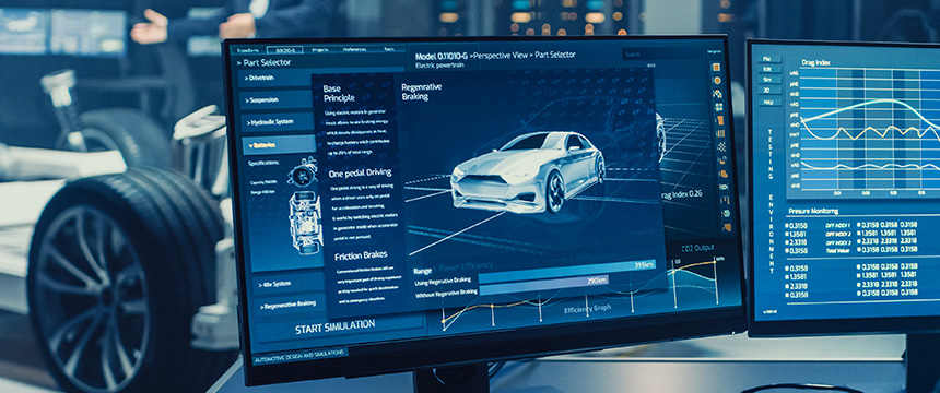 A computer monitor displays a 3D car model and various vehicle simulation data in a modern automotive engineering lab, providing valuable insights for intellectual property law and litigation support teams.