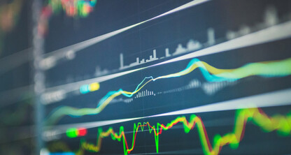 A close-up of a digital screen displaying multiple colorful financial graphs and charts, indicating market trends and data analysis in a corporate law office, supporting Chicago lawyers with litigation support.