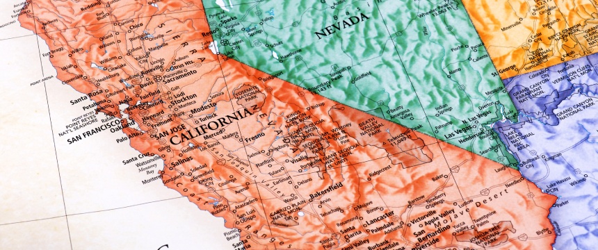 A close-up of a physical map showing parts of California and Nevada, with cities, terrain features, and state borders labeled—ideal for law offices or firms seeking detailed visuals for litigation support.