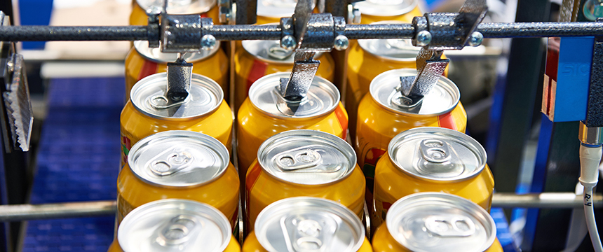 Rows of yellow aluminum cans move along a conveyor belt in a beverage production facility, much like cases passing through a busy corporate law office in Chicago.