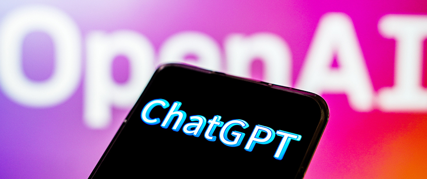 A smartphone screen displays the word "ChatGPT" in bright text, with a blurred "OpenAI" logo in the colorful background—perfect for chicago lawyers seeking innovative litigation support.