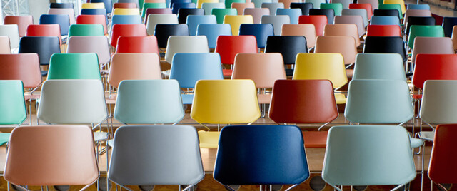 Rows of colorful empty seats.