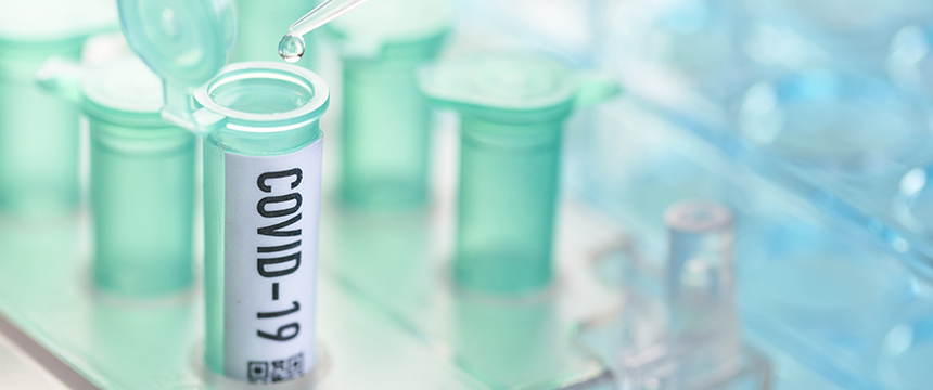 A plastic vial labeled "COVID-19" is open as a pipette dispenses a drop of liquid into it; in the background, similar vials evoke the precision found in intellectual property law offices.