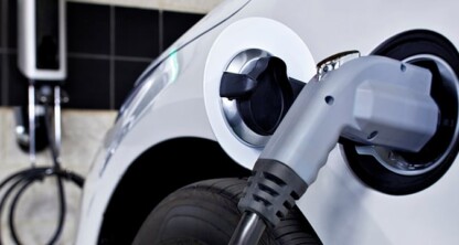 Close-up of an electric vehicle being charged, perfect for lawyers in Chicago or firms offering litigation support focused on the growing field of sustainable technology.