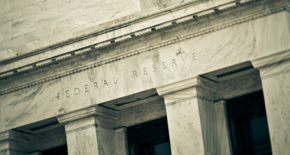Close-up view of the marble facade of the Federal Reserve building, an iconic site often referenced by corporate law offices and lawyers in Chicago for matters relating to financial regulation.