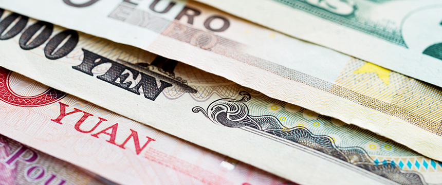 Close-up of various international banknotes, including euro, yen, yuan, and US dollar, arranged in overlapping horizontal layers—an image often relevant to Chicago lawyers specializing in litigation support and intellectual property law.