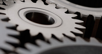 Close-up of several interlocking metal gears with sharp teeth, showing mechanical detail and precision engineering, reflecting the meticulous work and collaboration found in leading law offices and among top lawyers in Chicago.