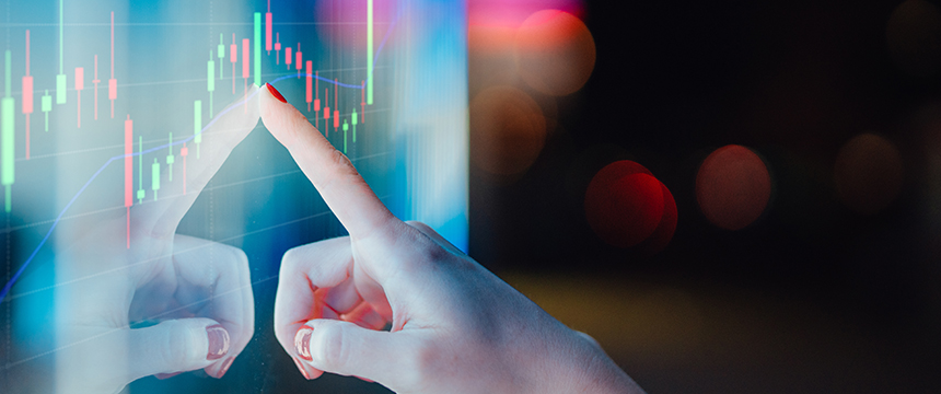 A hand with red nail polish touches a transparent screen displaying colorful financial graphs and candlestick charts—ideal for lawyers in Chicago seeking advanced litigation support against a dark, blurred background.