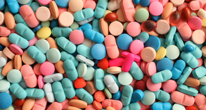 A large assortment of colorful pills and tablets in various shapes and sizes spread out in a random pile, much like the array of expertise you’d find at top corporate law offices or among skilled lawyers in Chicago.
