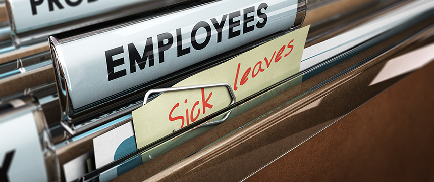 A close-up of file folders labeled "EMPLOYEES" and "Sick leaves" in an office filing cabinet, commonly found in corporate law offices for litigation support and efficient case management.