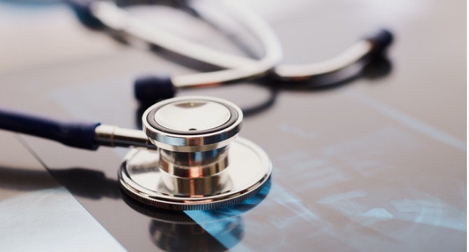 A stethoscope rests on top of an X-ray image, suggesting a medical or healthcare setting—an important scene for litigation support often relied upon by lawyers in Chicago.