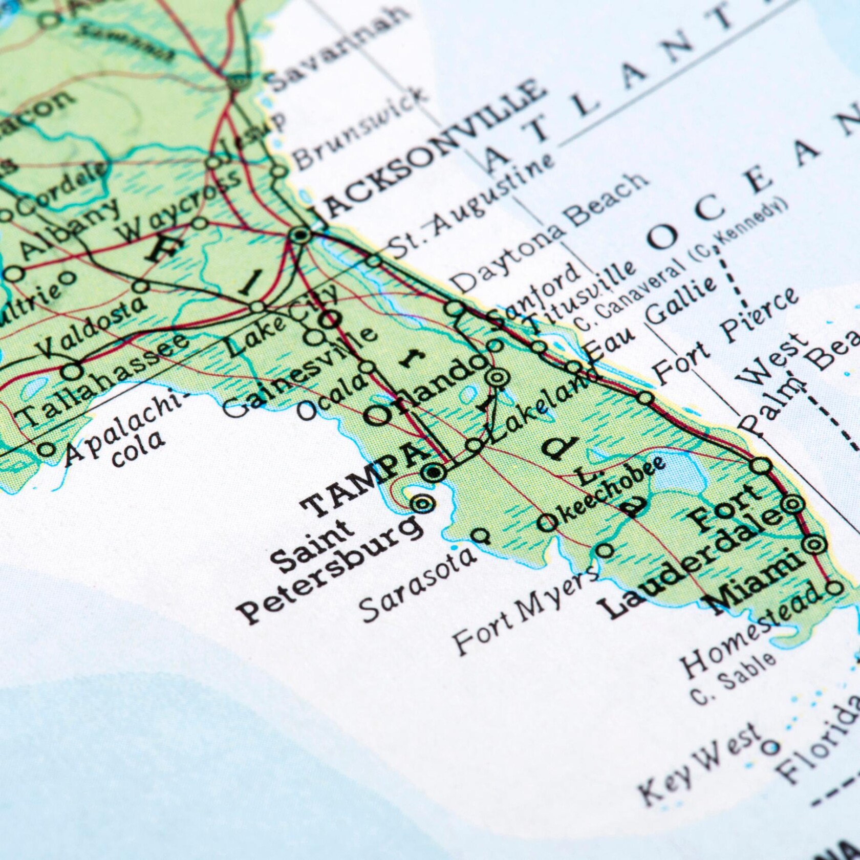 Close-up of a map showing the state of Florida, highlighting cities such as Tampa, Orlando, Jacksonville, Miami, and the surrounding area—ideal for corporate law office expansion or litigation support services.