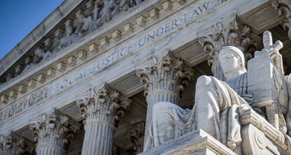 Marble statue and columns at the entrance of the United States Supreme Court building, with "Equal Justice Under Law" inscribed above—a symbol recognized by lawyers in Chicago and beyond for upholding intellectual property law.