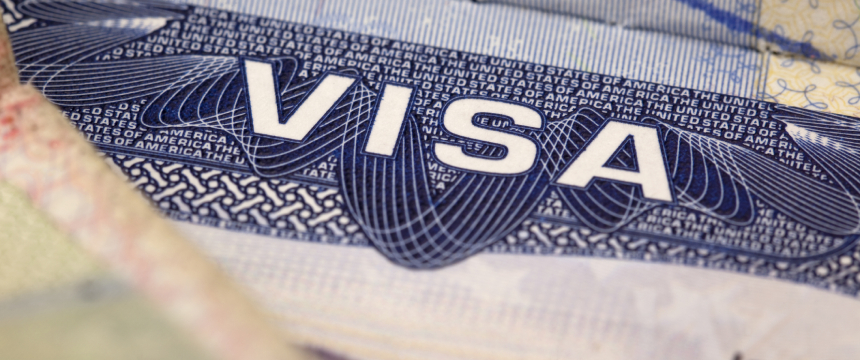 Close-up of a United States visa document showing the word "VISA" in bold letters with intricate security patterns, often handled by experienced lawyers in Chicago or specialized law offices.