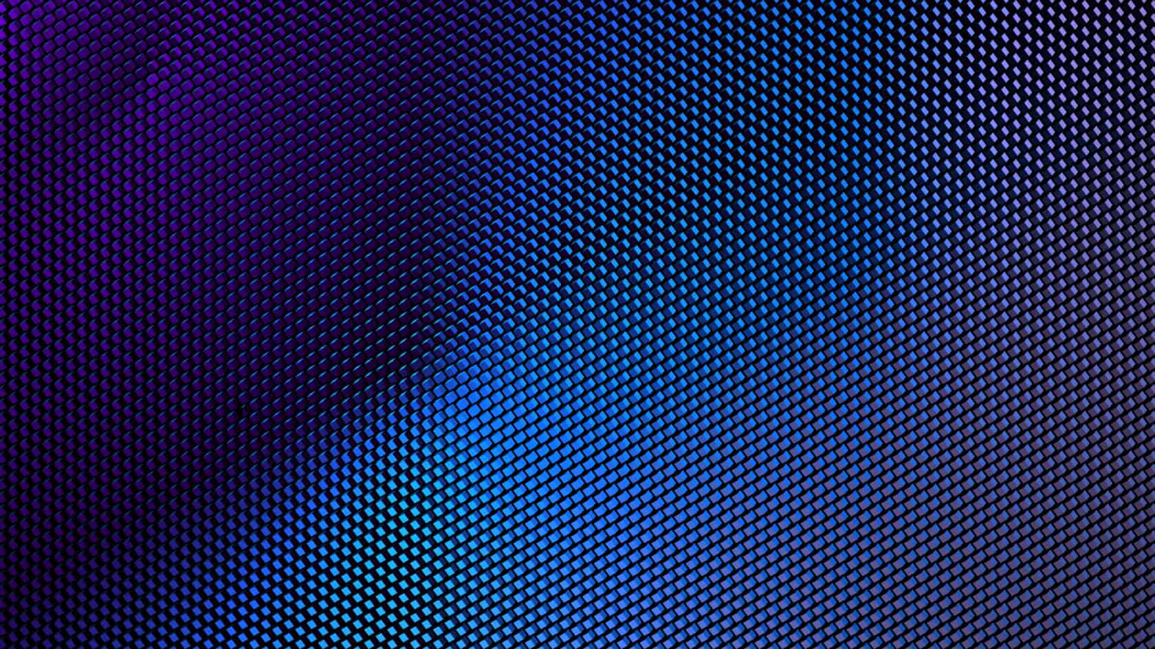 A close-up of a textured surface with a grid pattern, displaying a gradient of blue and purple lighting—an image that reflects the precision and innovation found in Chicago lawyers specializing in intellectual property law.