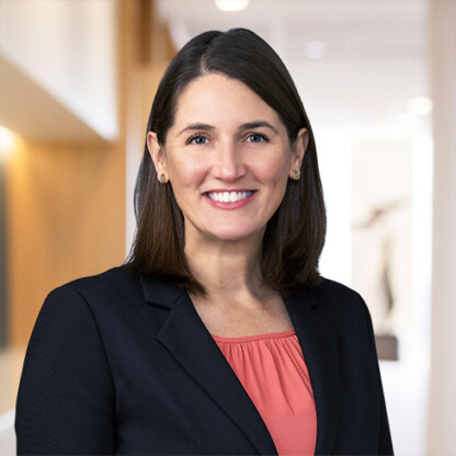 A woman smiling at the camera, reflecting the professionalism often seen in law offices.