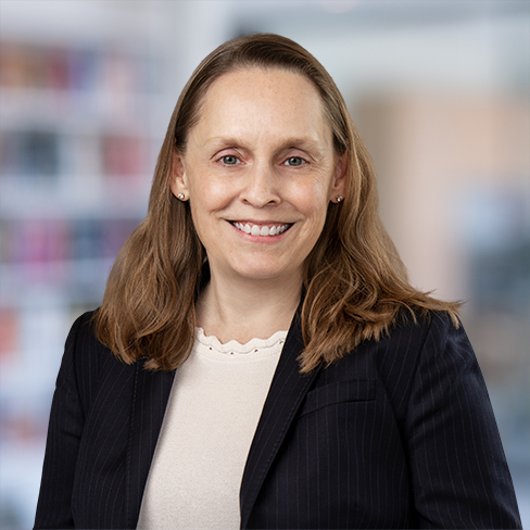 A woman smiling at the camera, representing the professionalism and approachability of top law offices and Chicago lawyers.