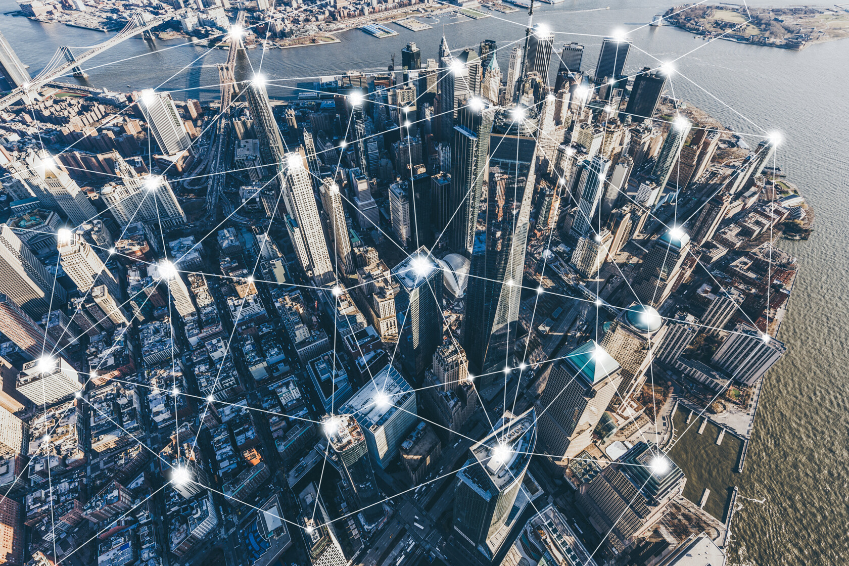 Aerial view of a city skyline with digital network lines and nodes superimposed, symbolizing urban connectivity, communication technology, and the collaborative reach of law offices and litigation support in Chicago.