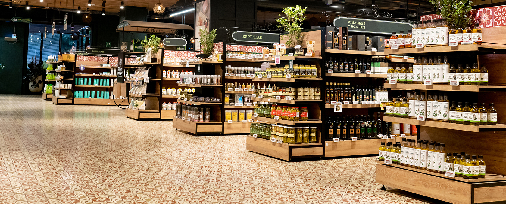 A spacious supermarket aisle with neatly organized shelves displaying various bottles, jars, and packaged goods—much like the meticulous order you’d find in top law offices or among experienced lawyers in Chicago.