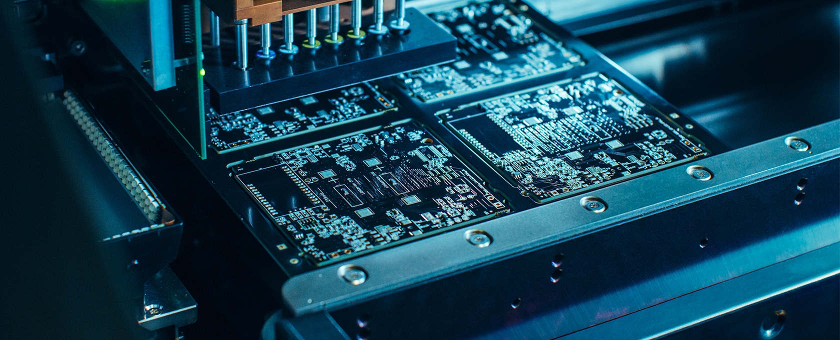 Close-up view of an automated machine assembling and testing circuit boards in an electronics manufacturing process, offering advanced solutions that can benefit lawyers in Chicago seeking reliable litigation support technology.