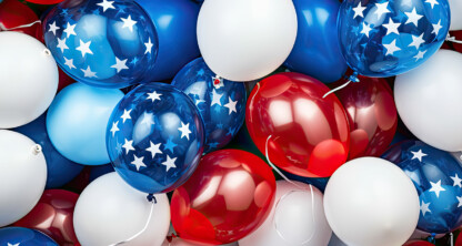 A cluster of red, white, and blue balloons, some with white stars on a blue background, creates a patriotic theme—perfect for celebrating law offices or lawyers in Chicago during special events.